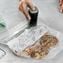 FoodSaver V1100 Cordless Handheld Vacuum Sealer with 2 Quart-Size Zipper Bags, Black Image 8 of 14